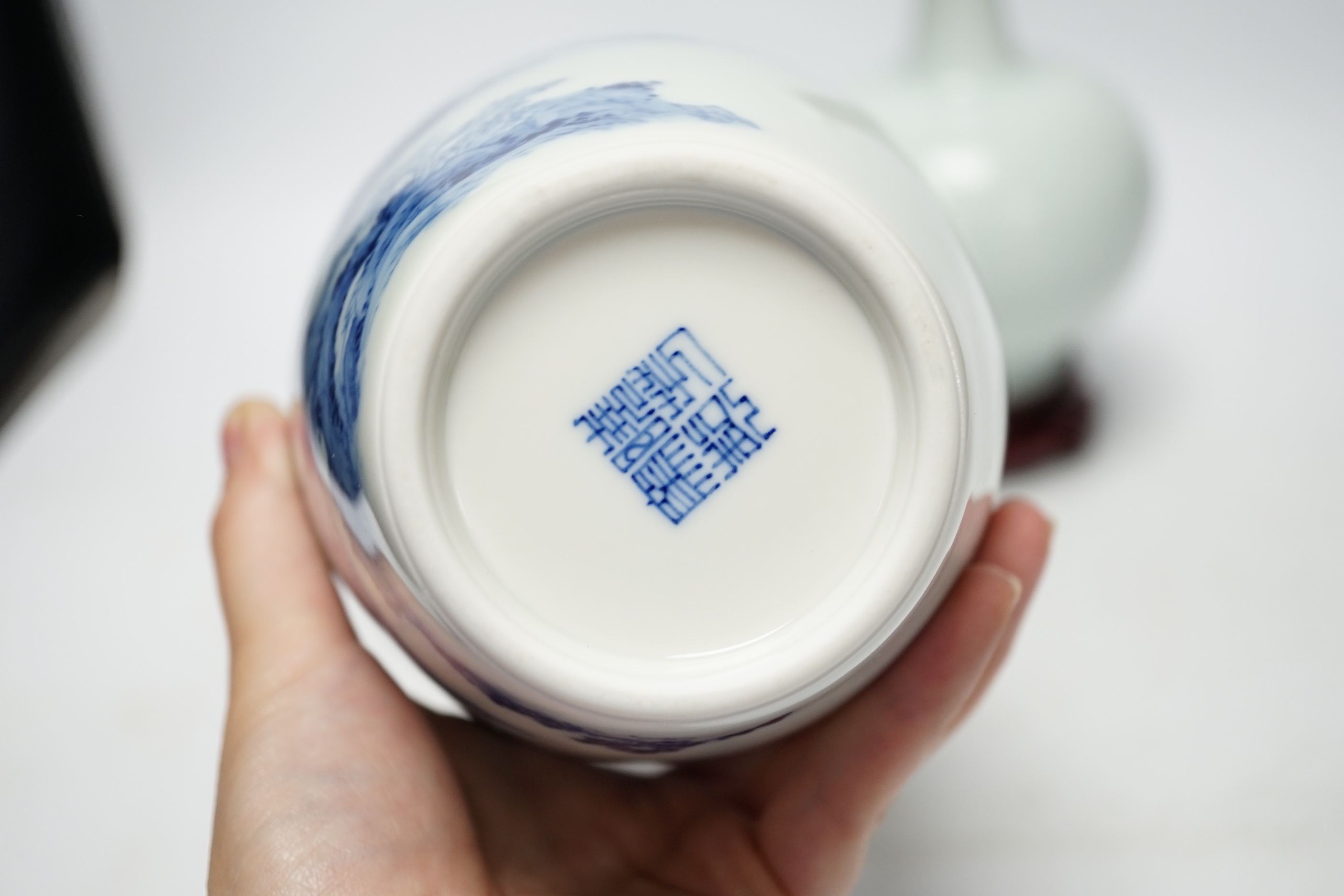Two modern Chinese blue and white vases on stands, a crackle glaze celadon bowl and vase, tallest 26cm including stand